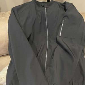 This is a NWOT XL Black light weight bomber or Military looking coat.